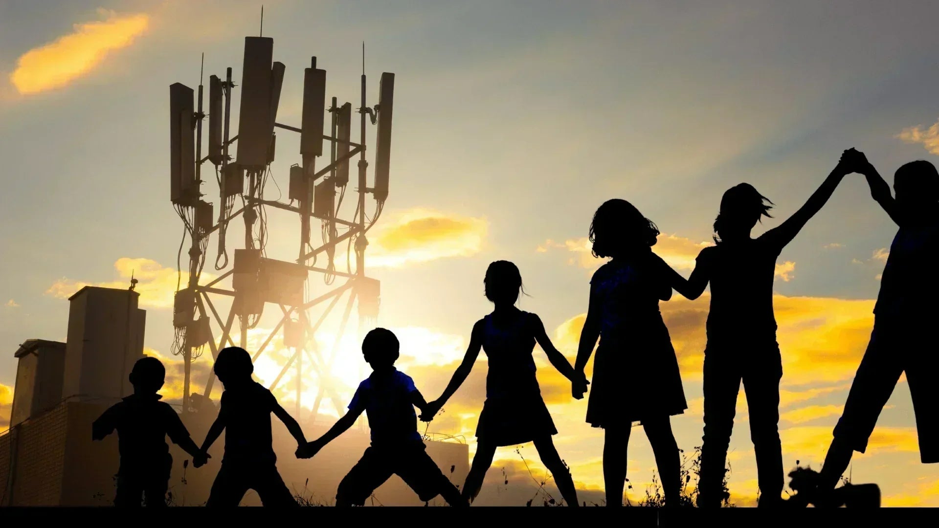 Children holding hands with a cell tower in the background, illustrating concerns about electrohypersensitivity.