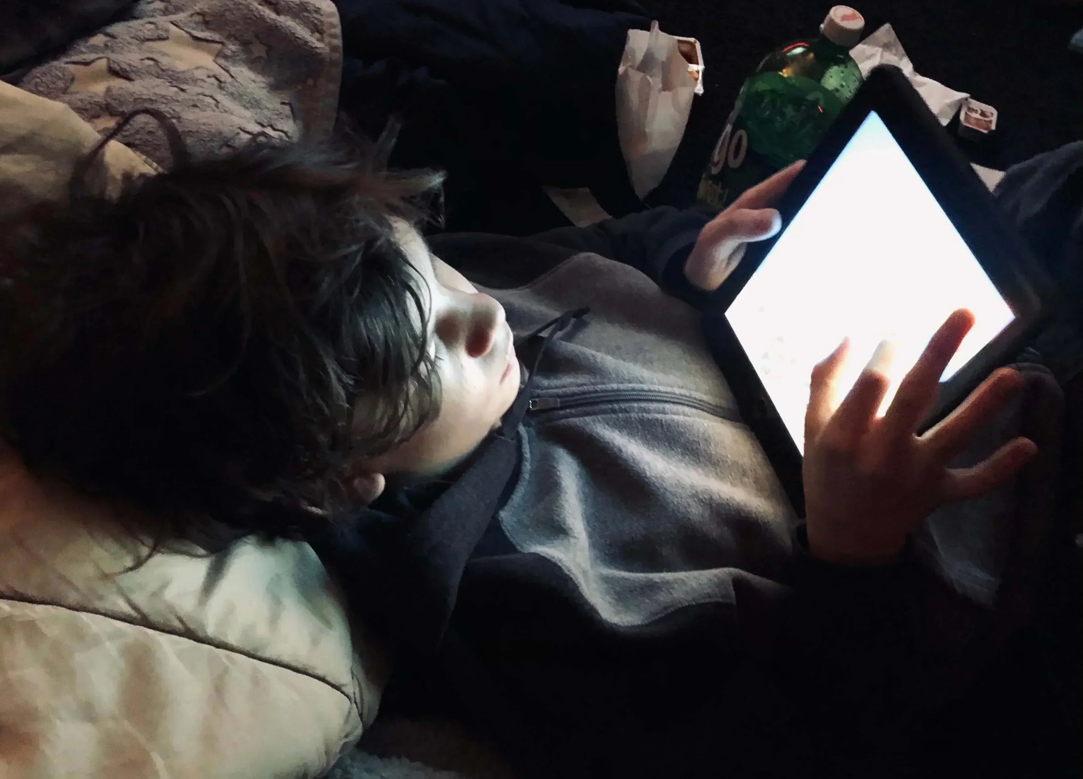 Child using a tablet device, highlighting the topic of emf exposure in children.