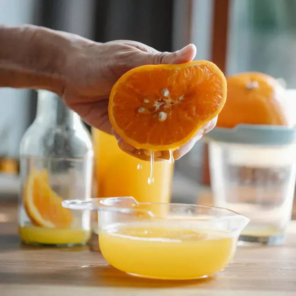 Freshly squeezed orange juice, highlighting natural detox foods in a healthy diet.