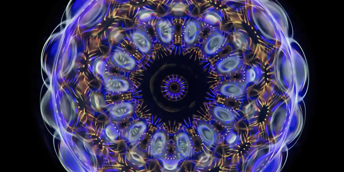 Cymatics frequency patterns illustrated through vibrant, symmetrical designs and shapes created by sound.