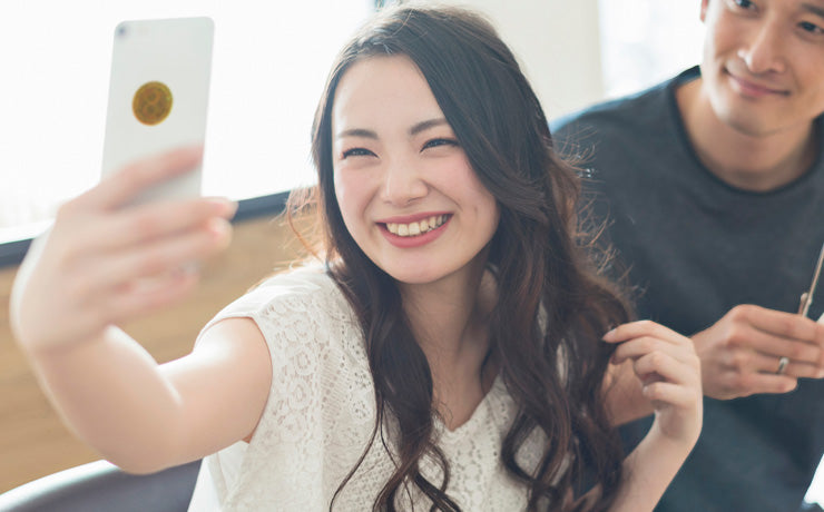 woman taking selfie with phone