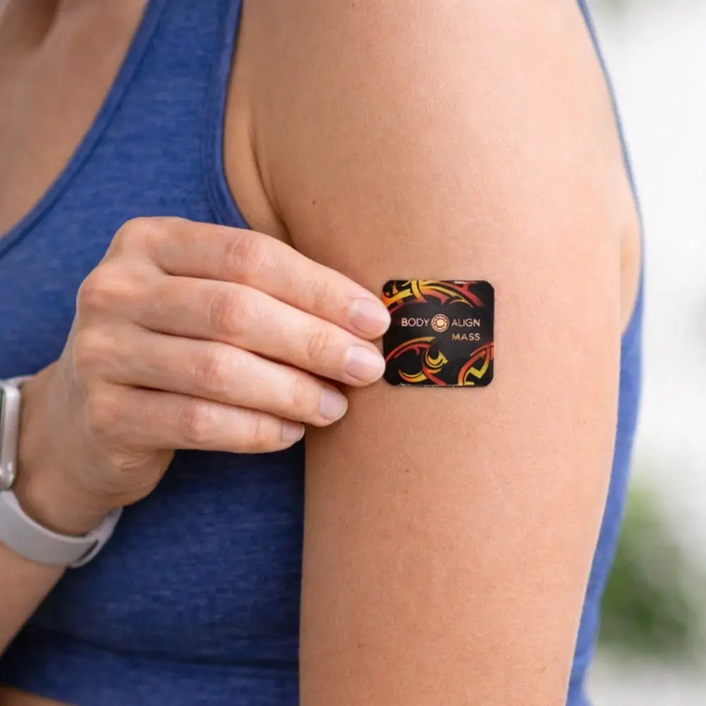 Person wearing a Mass Patch on their arm with Body Align branding.